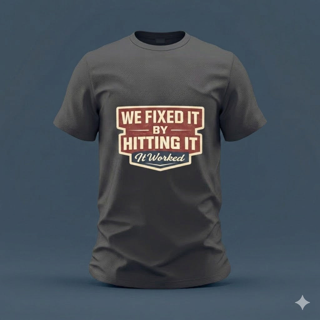 T-Shirt — “We Fixed It By Hitting It” Retro Mechanic Tee